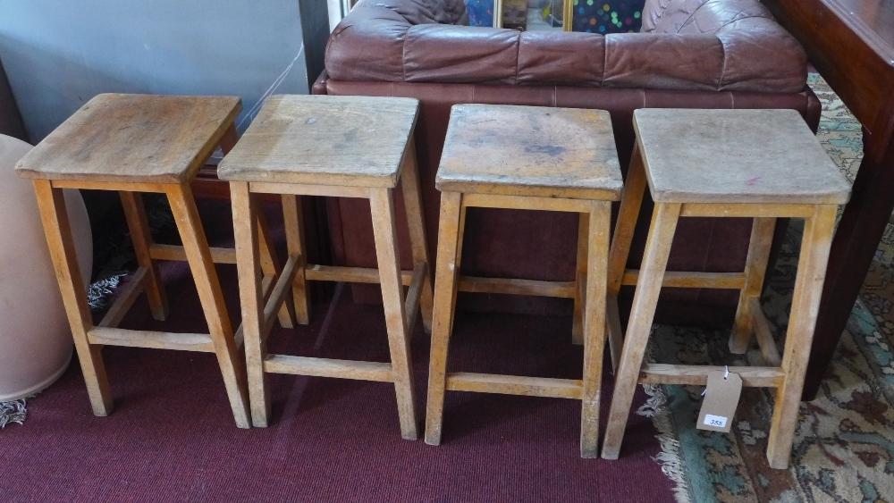 A set of four 20th century beechwood stools