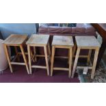 A set of four 20th century beechwood stools