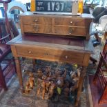 An early 20th century leather top desk with rosewood veneered drawers, H.100cm W.84cm