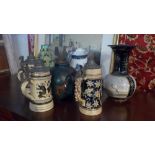 A collection of ceramics to include a Japanese vase and two early 20th century German tankards