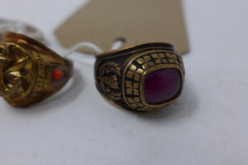 A brass and garnet graduation ring, together with a gilt metal ring inset with two rubies and anchor - Image 2 of 3