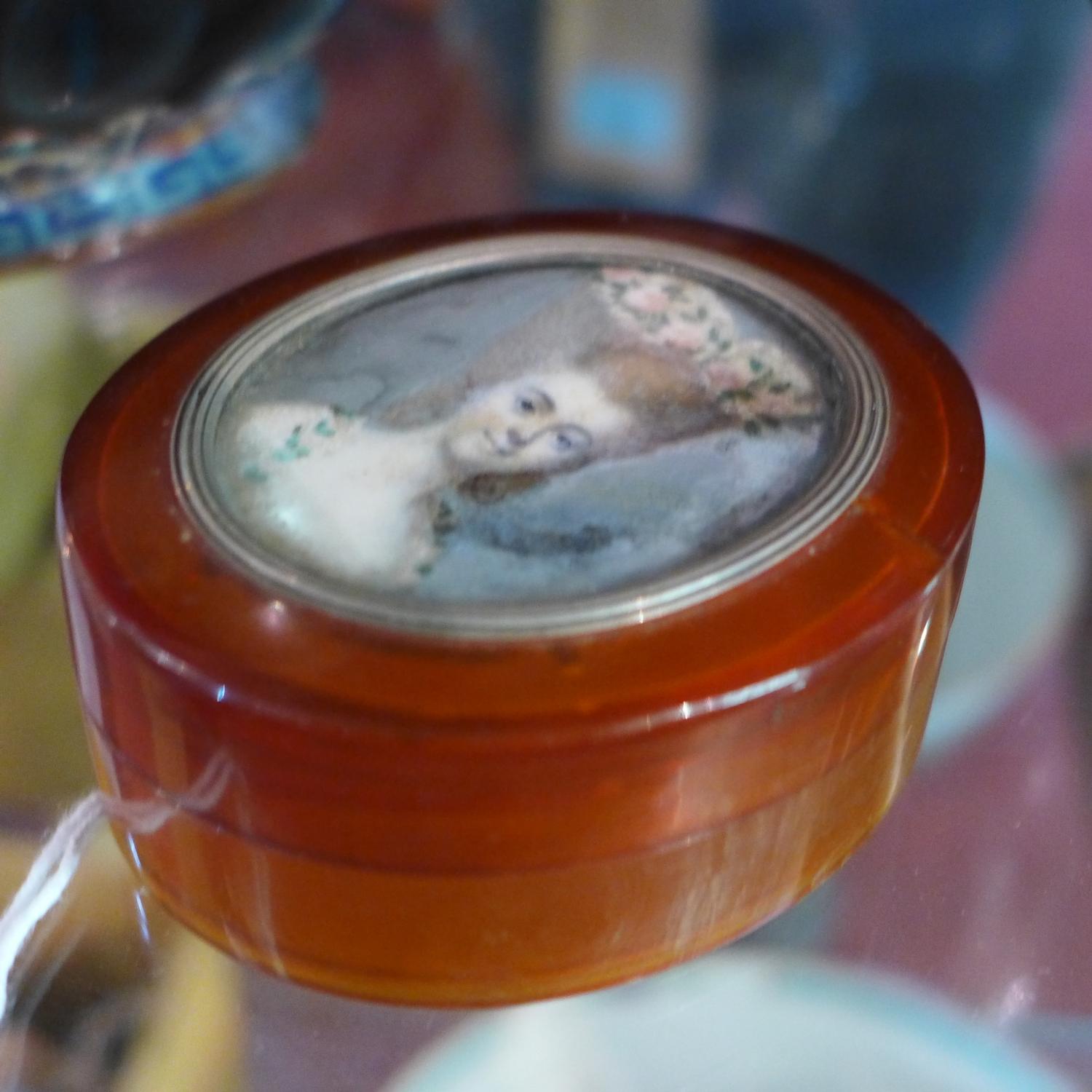 An 18th century miniature portrait of a lady, mounted in white metal on the lid of an amber - Image 3 of 6