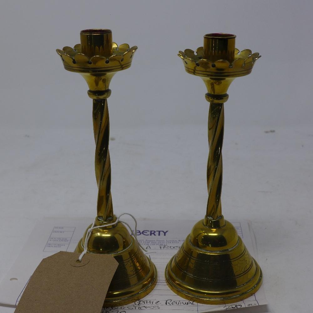 A pair of Victorian Gothic revival heavy brass candle sticks, bought from Liberty's with original - Image 2 of 3