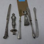 A collection of six silver items, to include a Continental silver stamp of tapered form, decorated