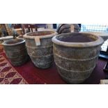 Four Atlantis style finish terracotta planters, comprising two large, H.62cm Diameter 58cm, and