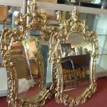 A pair of 18th century style ormolu pier mirrors, with ornate frames, 93x58cm