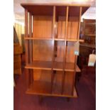A mid 20th century teak revolving bookcase, H.110 W.61 D.61cm