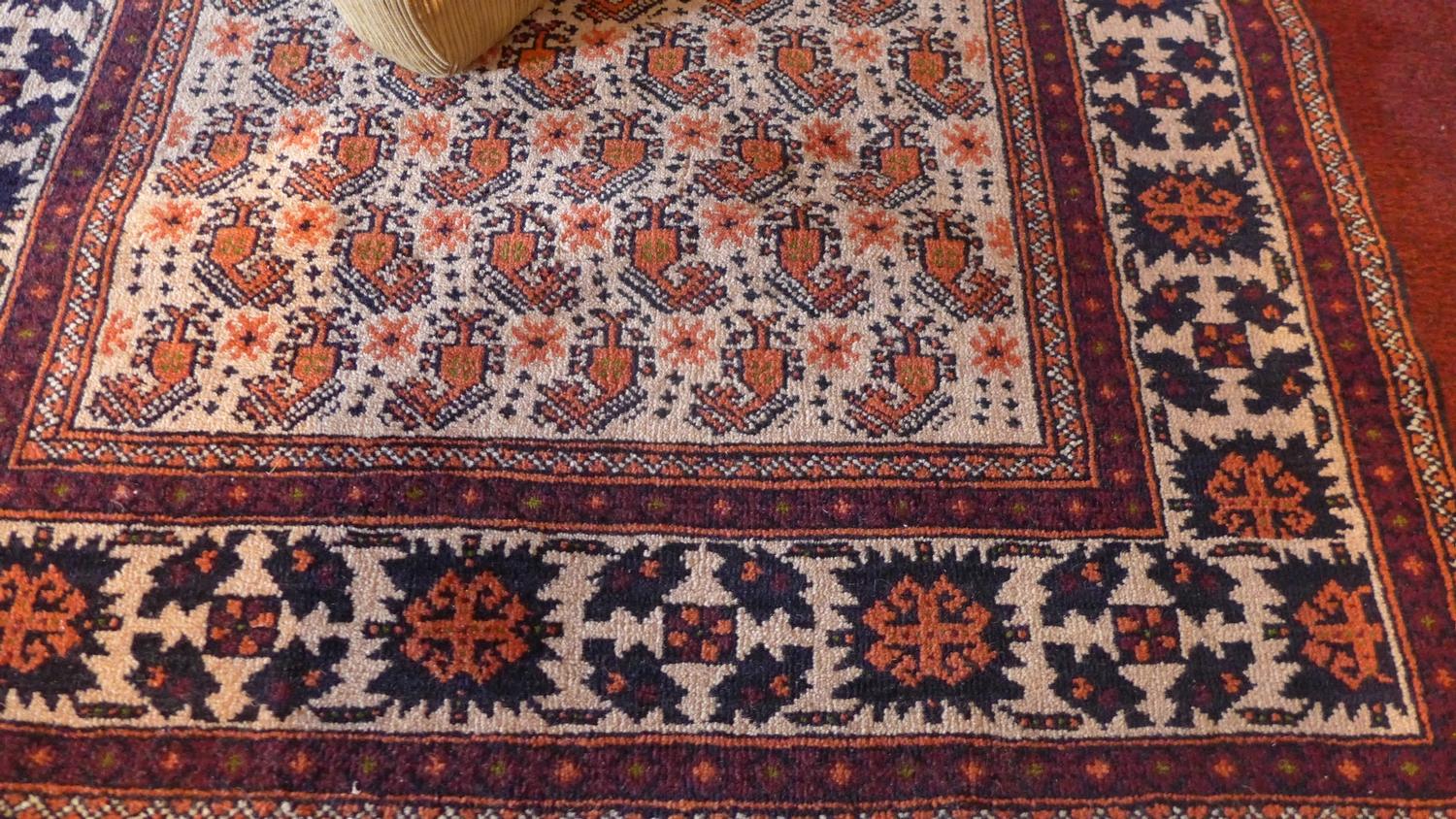 A Baloush rug, with central geometric motifs, on a beige ground, contained by geometric borders, - Image 2 of 3