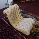 A Victorian mahogany slipper chair, with button back upholstery raised on turned legs and castors