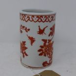 A Chinese late Republic porcelain brush pot, decorated in iron red with flowers and butterflies,