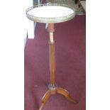 A 20th century French mahogany adjustable jardiniere stand, with marble top, raised on three splayed