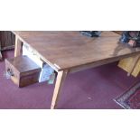 A large 20th century pine farmhouse dining table, raised on tapered legs, H.74 W.260 D.127cm
