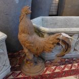 A cast iron cockerel, on stepped circular base, H.42cm