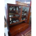 A mid 20th century Danish rosewood bookcase by Bouer Mobelfabrik, with two glazed doors enclosing