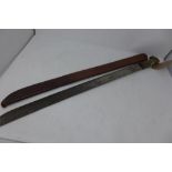 An American WWII Legitimus Collins & Co. machete, horn handle, marked to blade and scabbard,