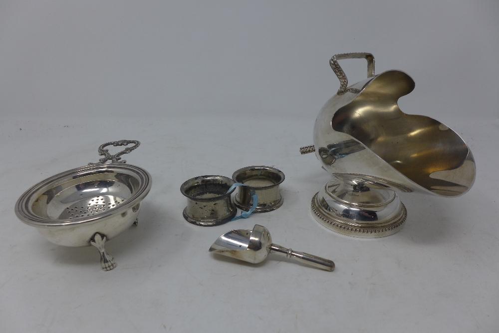 A novelty silver plated sugar bowl, modelled as a coal scuttle, with serving scoop, together with