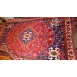 A fine South West Persian Afshar carpet, central diamond medallion with repeating petal motifs on