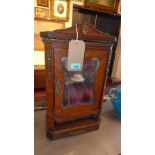 A late 19th century French walnut table top armoire, with original mirror glass door, having