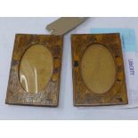 A pair of Art Nouveau inlaid oak photograph frames, bought from Liberty's with original receipt