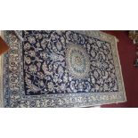 A Central Persian part silk Nain rug, central medallion with repeating petal motifs on a sapphire