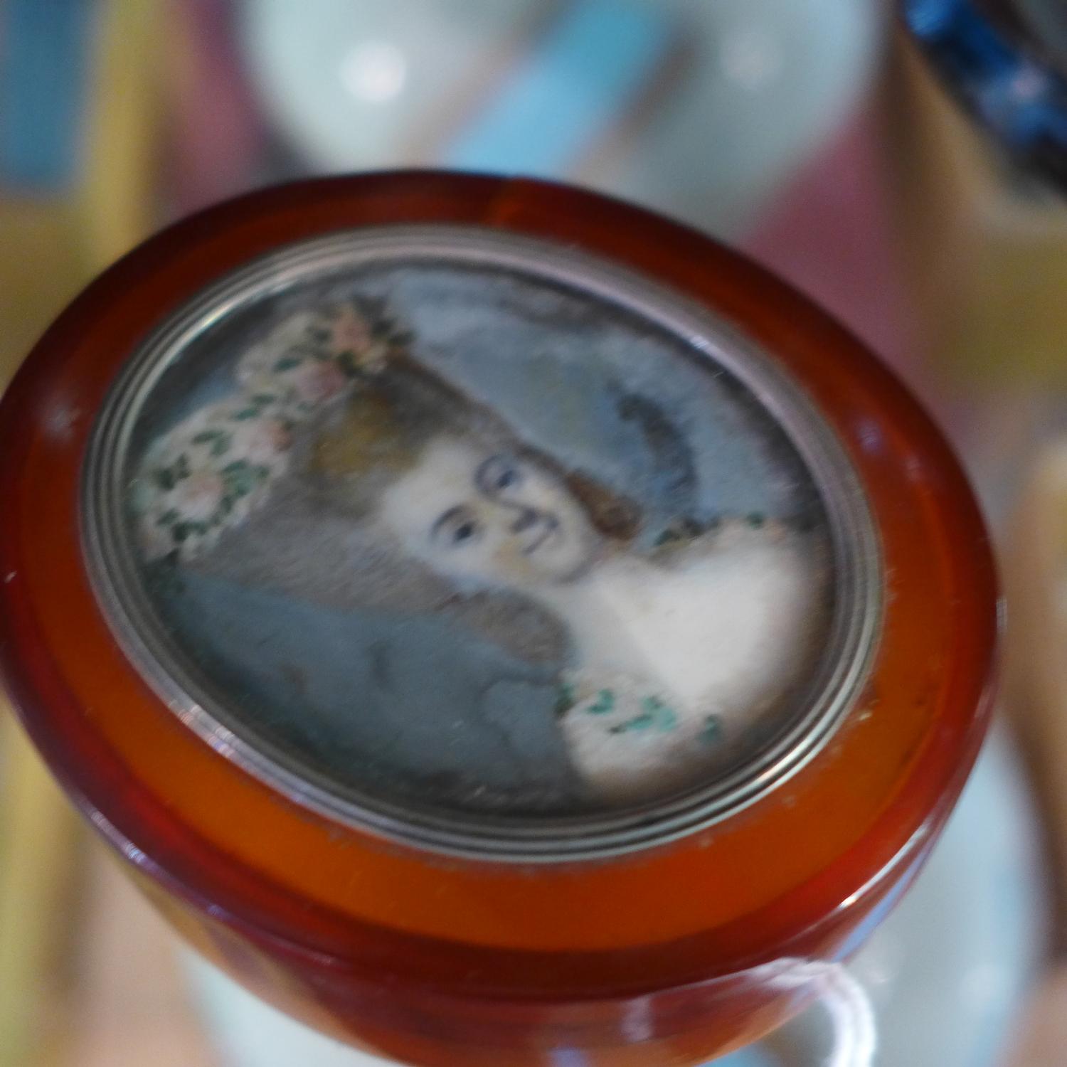 An 18th century miniature portrait of a lady, mounted in white metal on the lid of an amber - Image 5 of 6