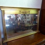 A contemporary gilt oval mirror, with bevelled plate, 72 x 111cm