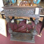 A Victorian carved oak plant stand, H.109 W.82 D.32cm