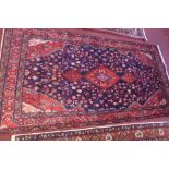 A North West Persian Nahawand rug, central diamond medallion with repeating spandrels on a