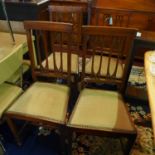 A set of four Edwardian inlaid mahogany dining chairs raised on tapered legs, spade feet, joined