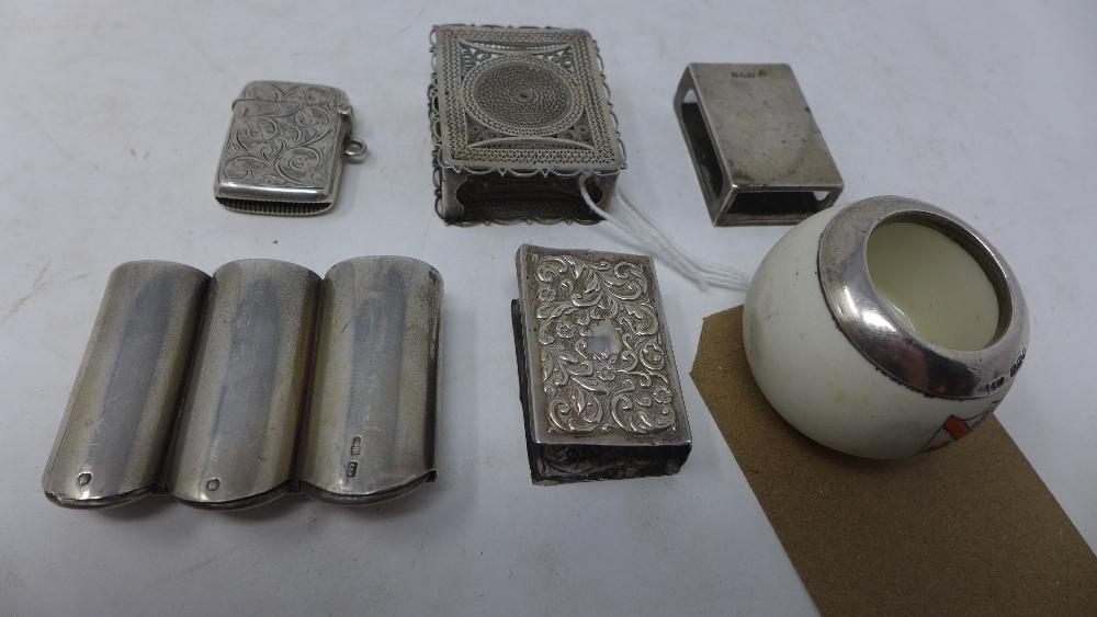 A collection of silver, to include a Russian silver three cylinder coin holder, hallmarked, a silver