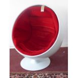 A 1960's fibreglass ball chair, with red velour cushion