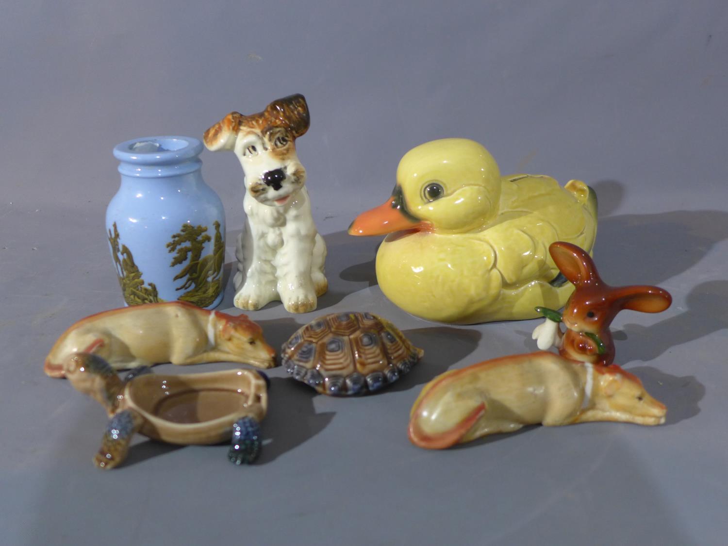 A collection of ceramics to include a pair of greyhounds, a Goebel duck money box, a 19th century