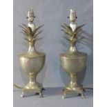 A pair of silver plated pineapple lamps, raised on four paw feet, H.40cm (2)