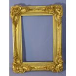 A 19th century out swept gilt wood picture frame, recently re-painted, 96 x 72cm