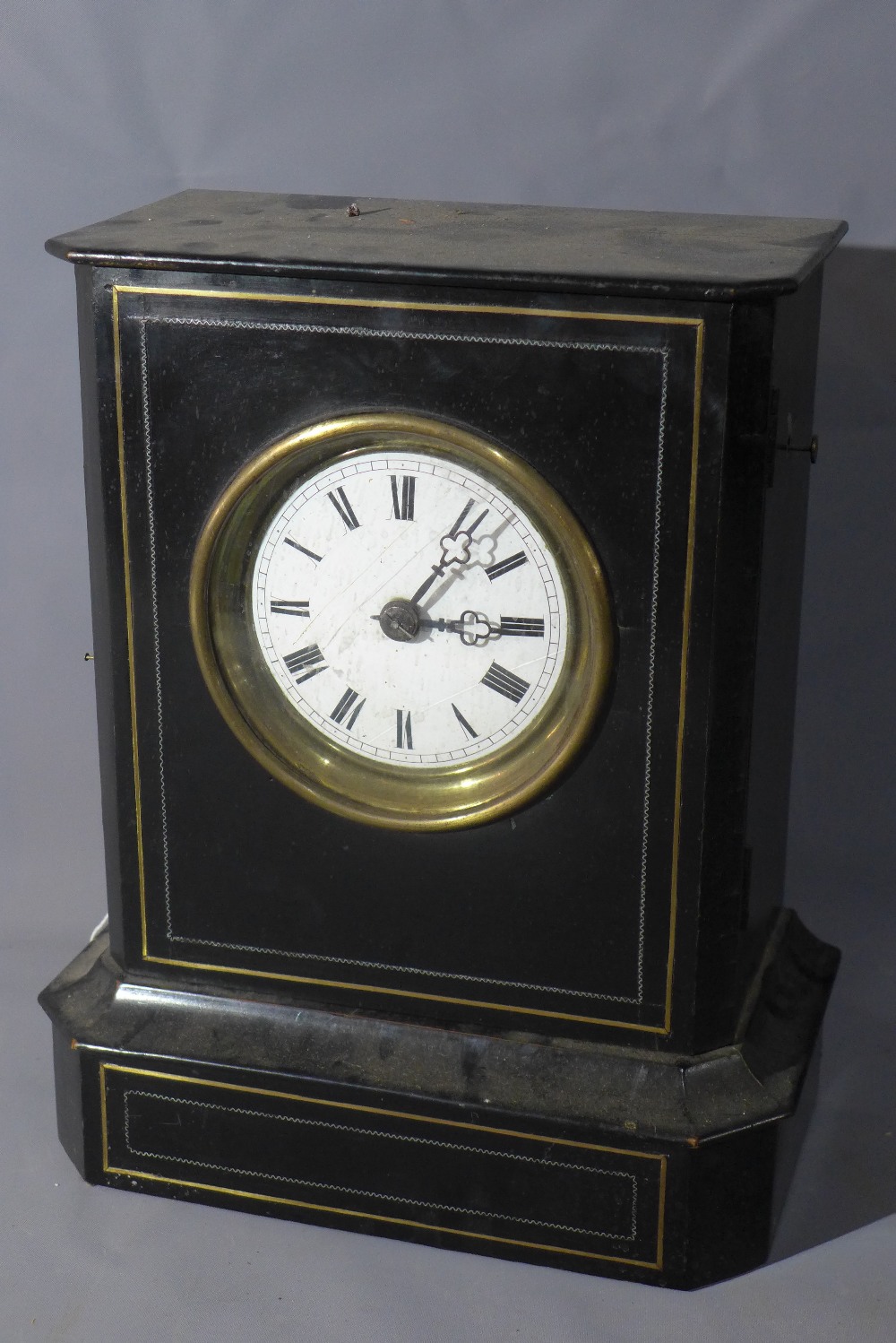 A late 19th century French ebonised mantel clock, Roman dial, two train movement, in brass mounted