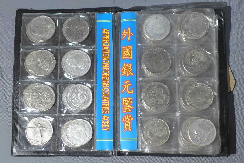 A collection of 80 foreign coins in display folder, including USA, New Zealand, Philippines and - Image 3 of 6