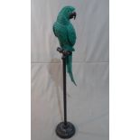 A fibreglass model of a parrot on stand