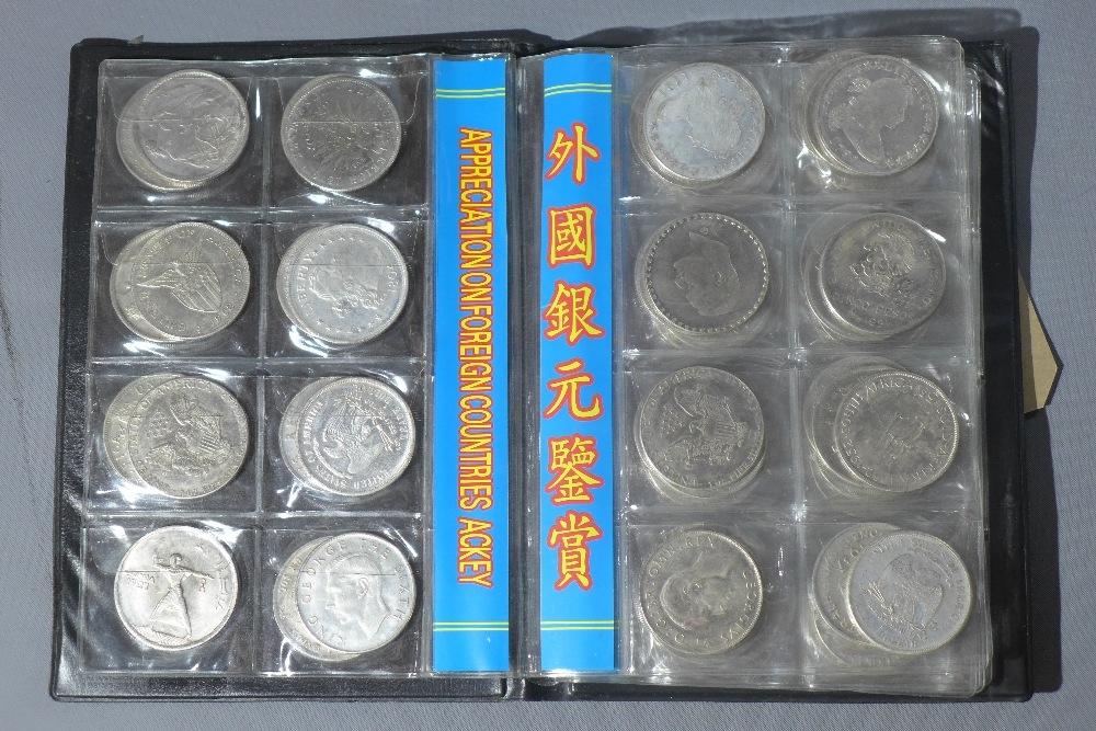 A collection of 80 foreign coins in display folder, including USA, New Zealand, Philippines and - Image 4 of 6