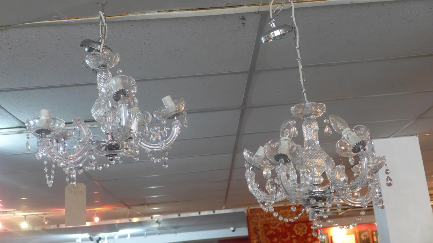 A pair of five branch chandeliers, with droplets, H.32cm