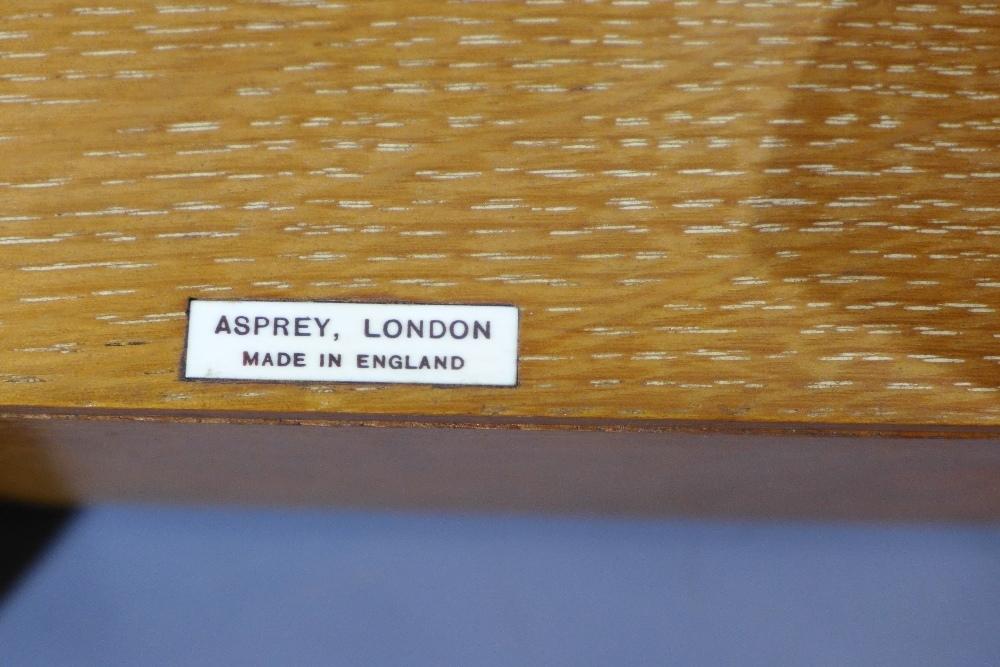 An Asprey and Co. Ltd Reference Library, in a oak book rest holding eight leather bound books, - Image 4 of 4