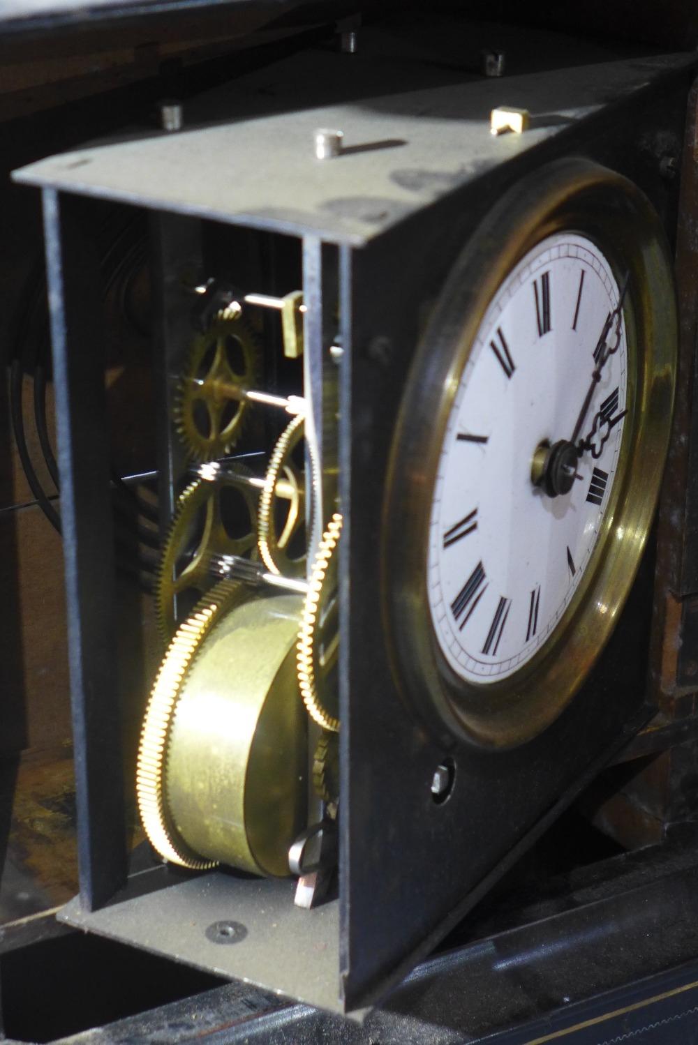 A late 19th century French ebonised mantel clock, Roman dial, two train movement, in brass mounted - Image 4 of 4