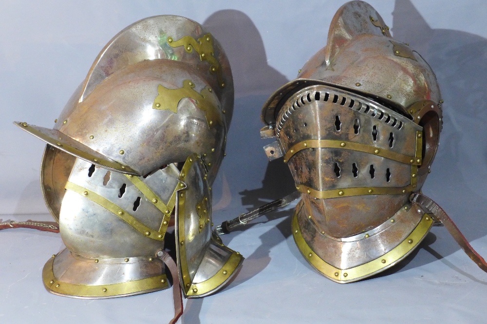 A near pair of knight's helmets