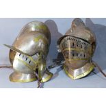 A near pair of knight's helmets