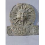 A lead Sun firemark insurance plaque, with rising sun in a disc over rectangular panel and impressed