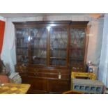 An early 20th century mahogany and burr walnut library secretaire breakfront bookcase, with four