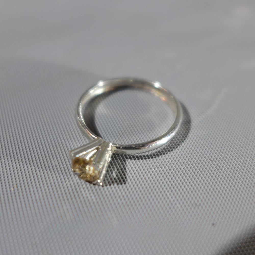 A white metal solitaire diamond ring, the round cut diamond approx. .45cts, tests as gold - Image 2 of 4