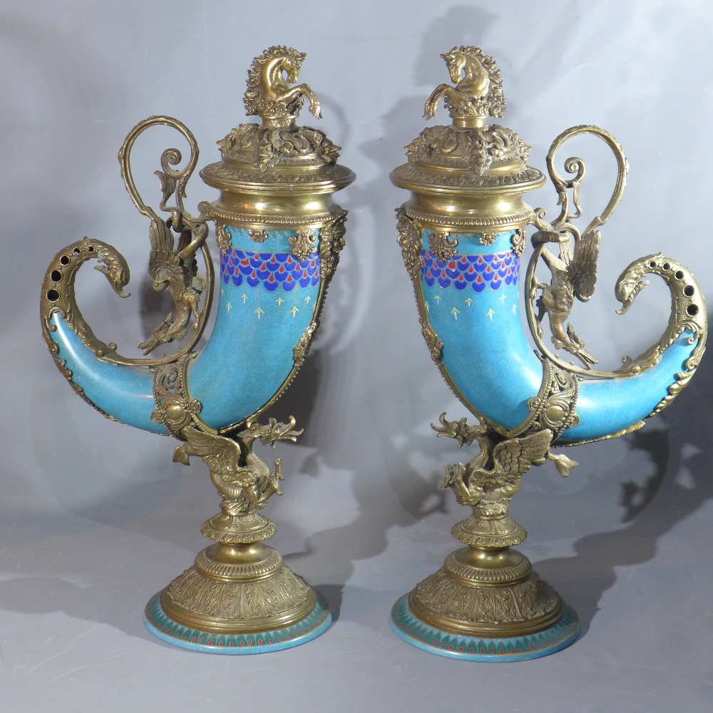 A pair of Austrian style bronze and ceramic cornucopia Vases, mounted with bronze Lindwurm (