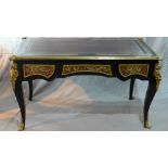 A Louis XV style ebonized boulle desk, having leather top, ormolu mounts, three drawers, raised on