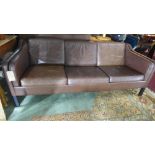 A three seater brown leather sofa