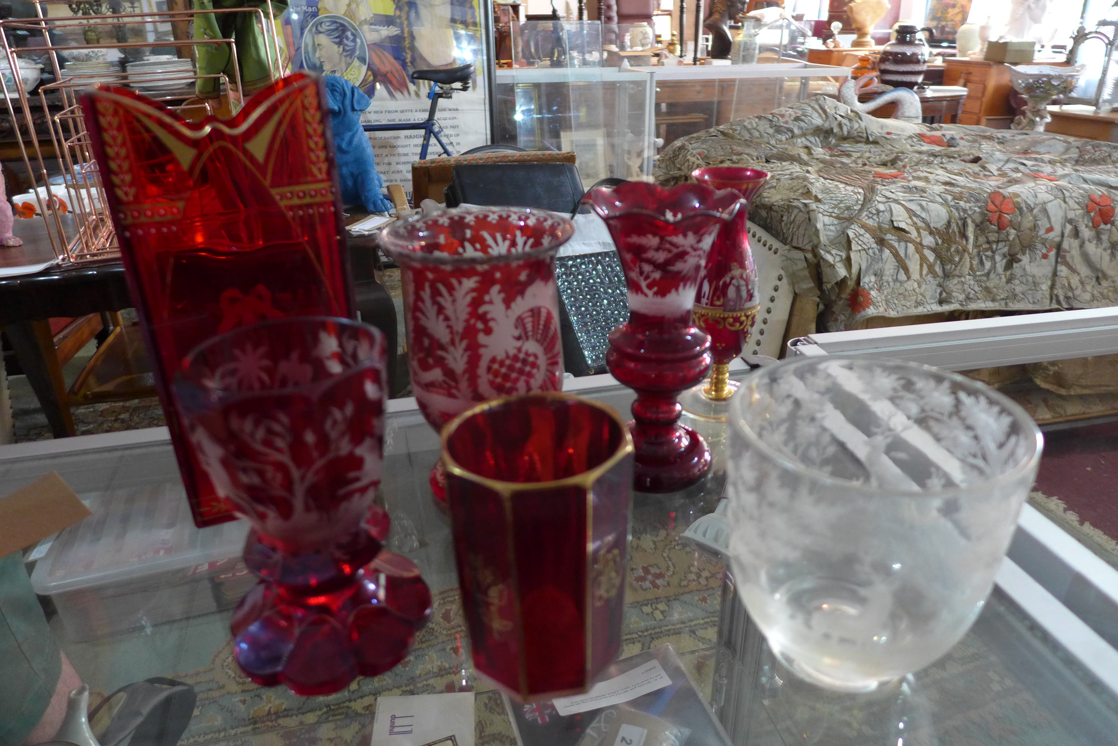 A collection of finely cut cranberry glass